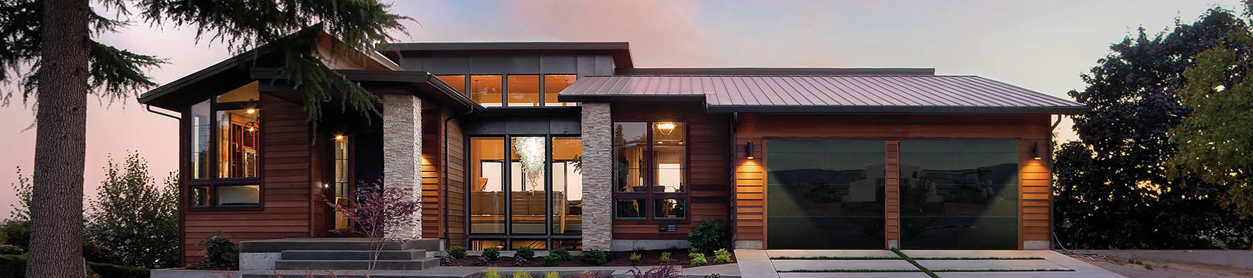 beautiful home featuring double garage doors